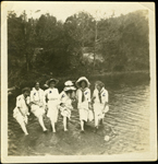 Women standing in a creek