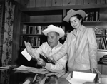 Lyndon Baines Johnson and his wife Claudia “Lady Bird” Taylor Johnson don cowboy hats and leather jackets
