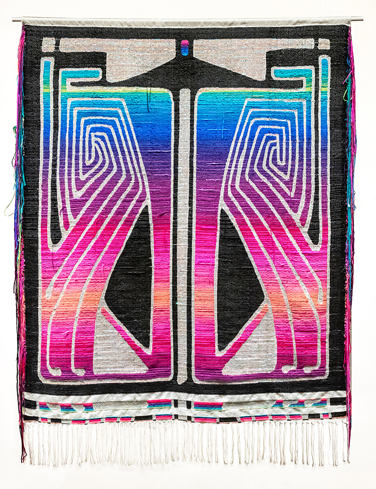 Brightly colored, geometric weaving, image resembles butterfly wings