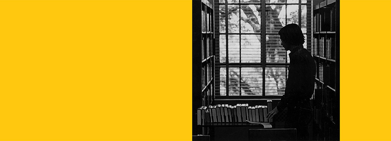 Person with book card in the library