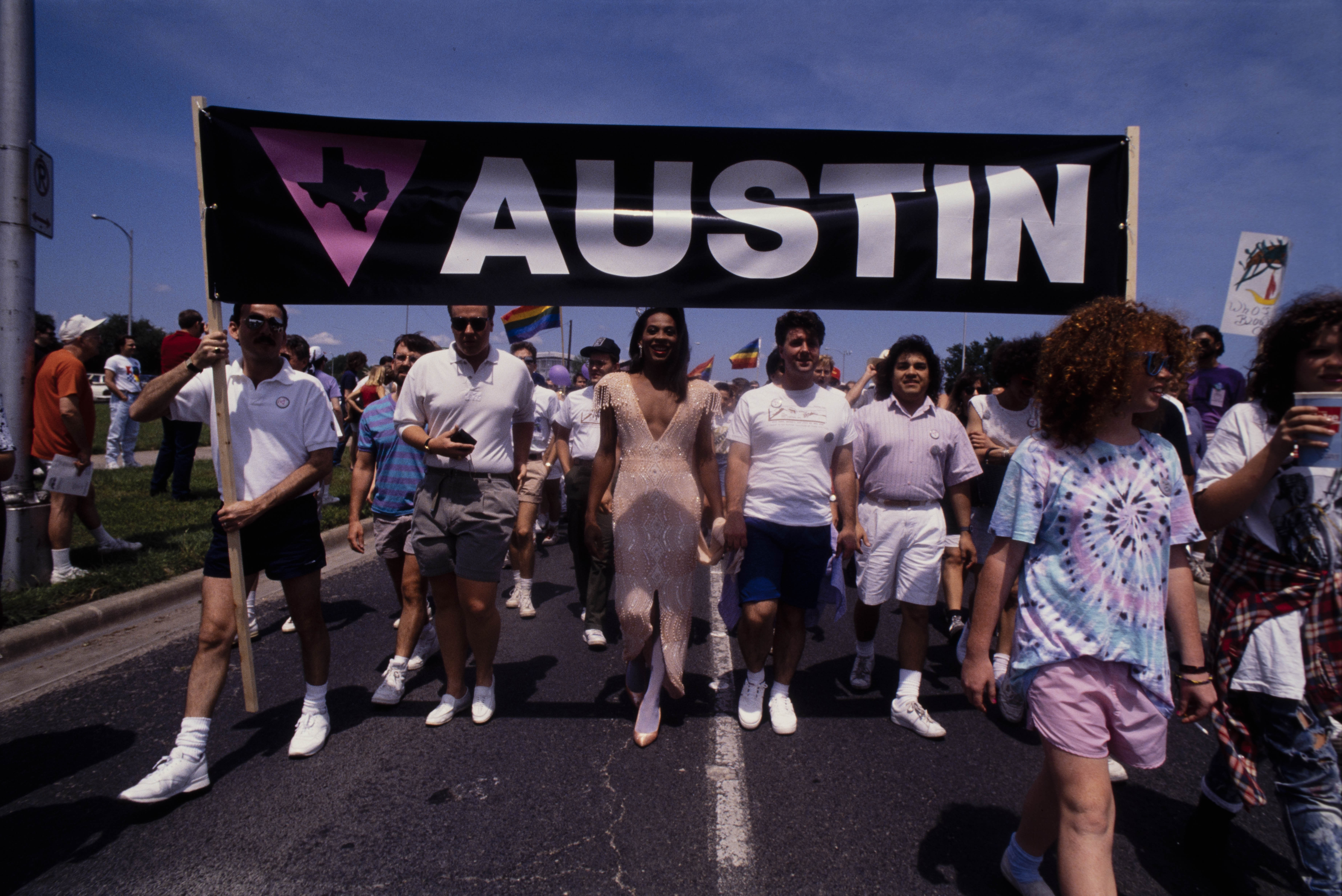 People holding Austin banner at March on Austin on April 30, 1989