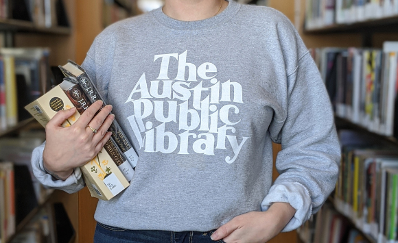 woman standing in Library sweatshirt in Library