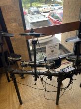 An electric drum kit is shown with instructions on how teens can play. 