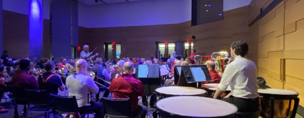 brass musicians performing in front of an audience