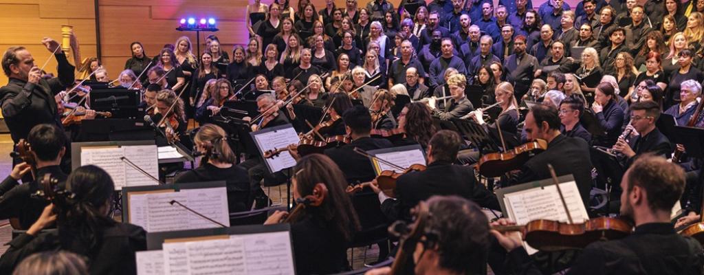 full orchestra playing at library