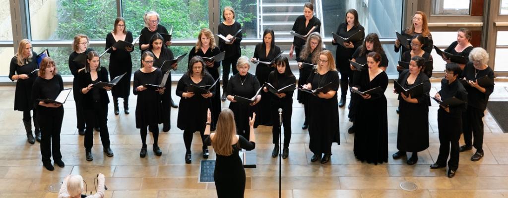 women singing on stage 