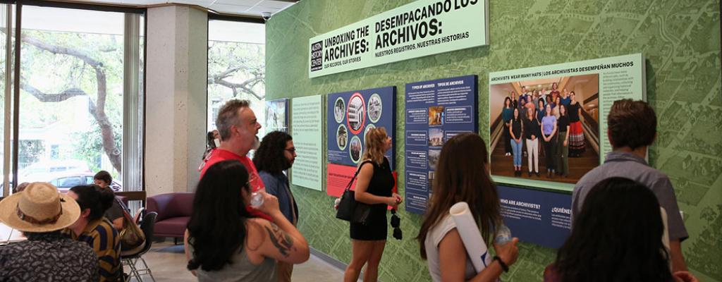 people looking at exhibit