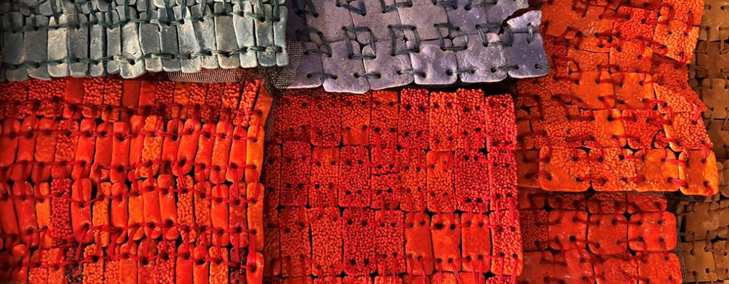 Closeup photo of clay beads by Moyo Okediji