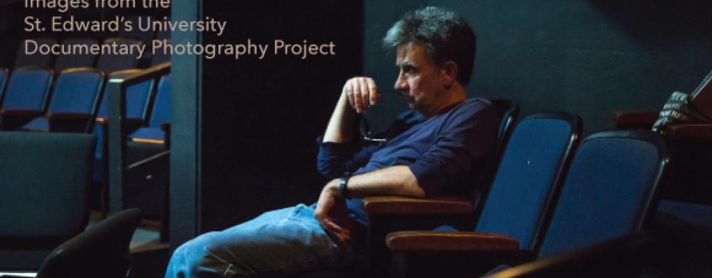 Man sitting in a chair with the text Discovering Place Images from the St. Edward’s University Documentary Photography Project