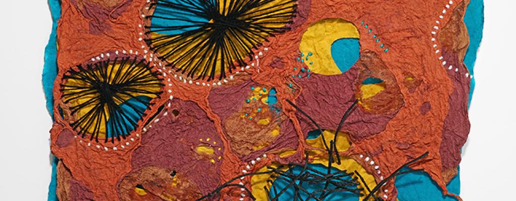 Rust, turquoise and gold colored handmade paper with sewn designs 