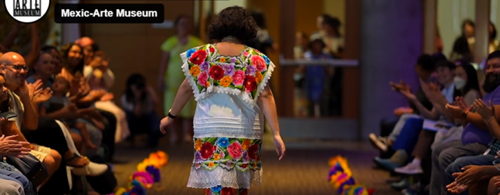 women walking runway with creation on