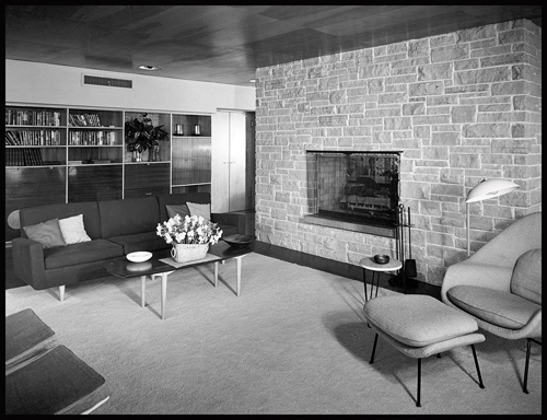 Brick fireplace with a chair and couch